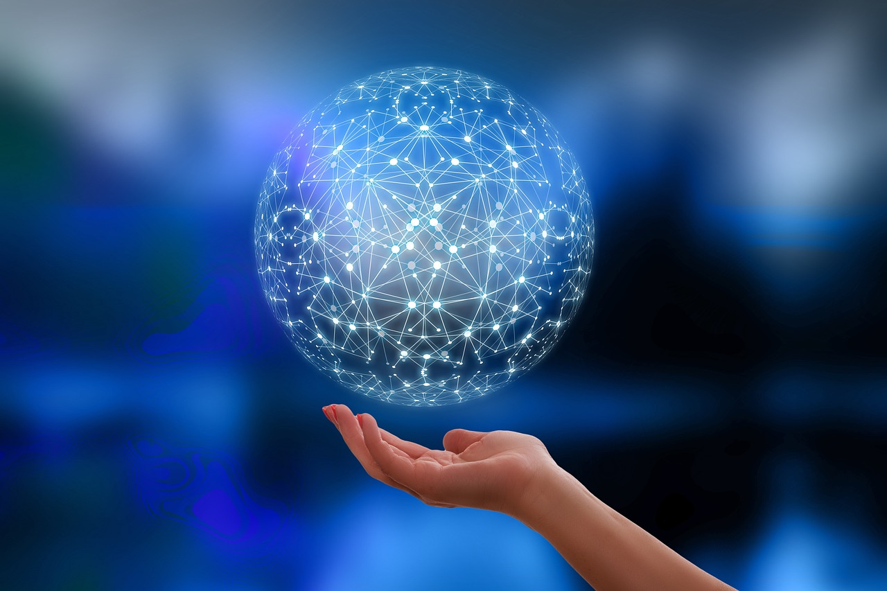 A futuristic, illuminated ball floating above an open palm.